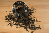 shan valley mountain roasted green tea and strainer